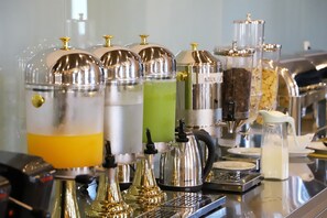 A barista station with various coffee machines and milk dispensers. - Hotel Colombo (Berat)