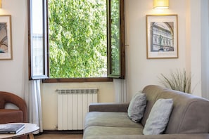 Apartment, 3 Bedrooms | Living area | Flat-screen TV