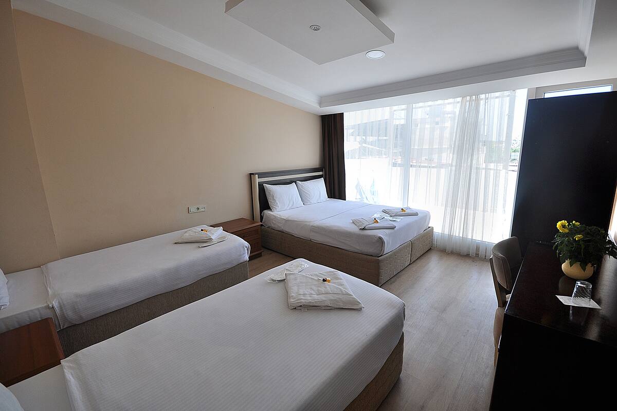 Deluxe Quadruple Room, Balcony, Partial Sea View