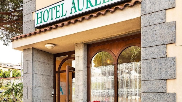 A hotel entrance with a sign reading "HOTEL AURELIA." - Hotel Aurelia (Tarquinia)