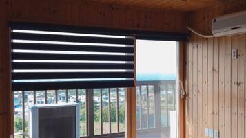 Deluxe Room, 2 Bedrooms | Living area | Flat-screen TV