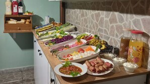 A kitchen counter with various food items and condiments. - Emirhan Hotel - Adults Only (Istanbul)