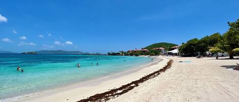 On the beach, sun-loungers, beach towels, beach bar