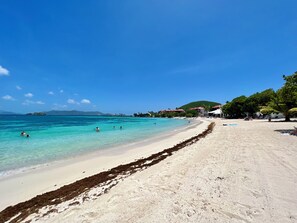On the beach, sun-loungers, beach towels, beach bar