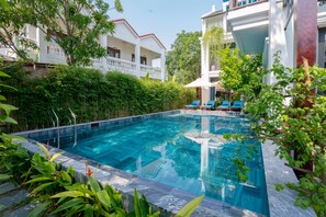 Outdoor pool, pool umbrellas, sun loungers
