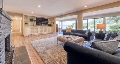 Waterfront home & on-site guest house w/ full kitchens, a large deck, & firepits