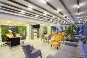 Relax in a welcoming space with a reception area, seating area, and dining space, perfect for meetings or unwinding.