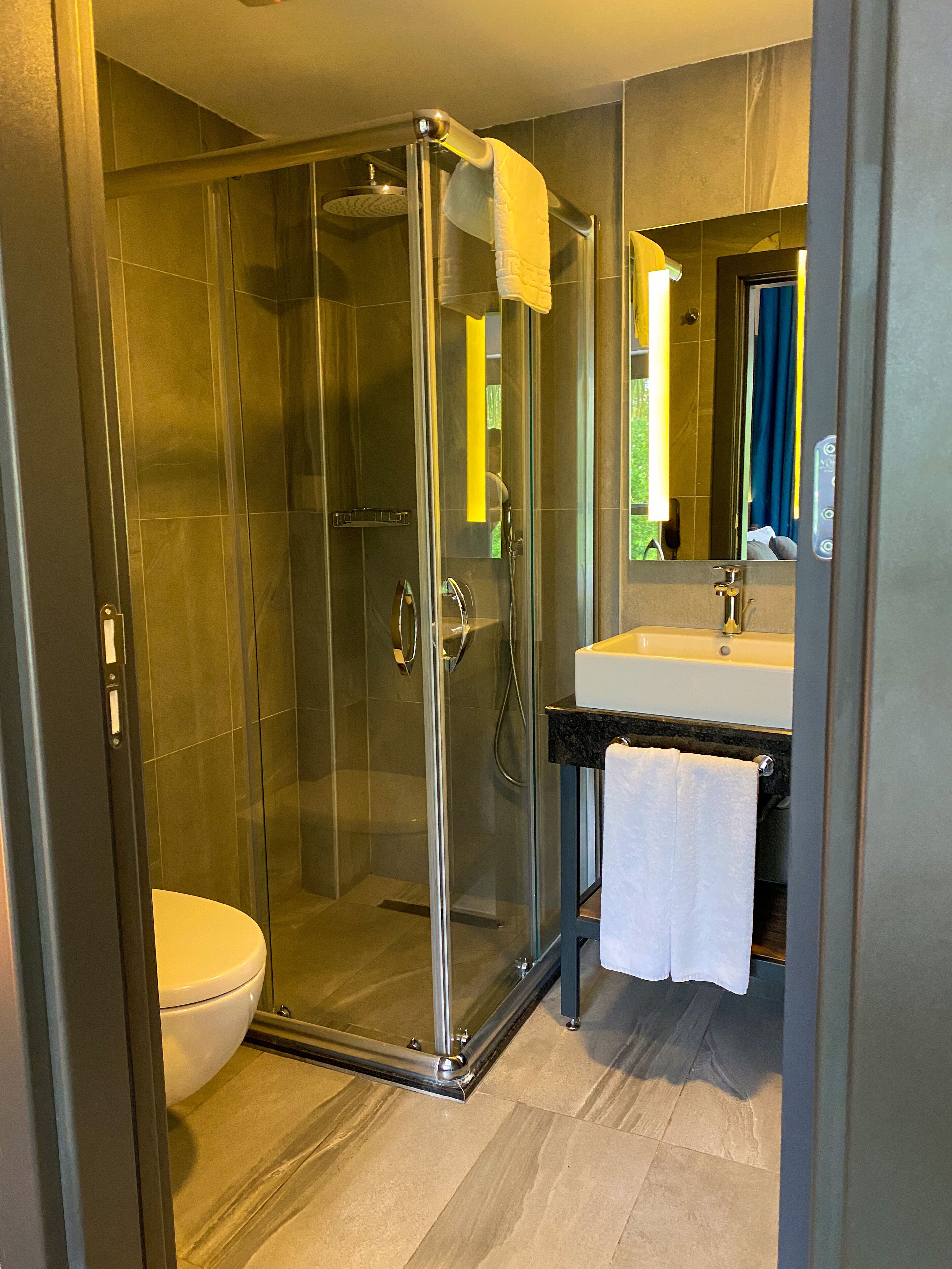 shower, rainfall showerhead, hair dryer, slippers