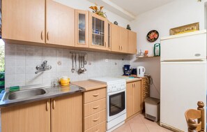 Fridge, stovetop, coffee/tea maker, cookware/dishes/utensils
