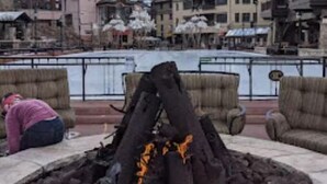A fire pit with logs and embers, surrounded by outdoor seating. - Availability 11/30/19 to 12/7/19  (Beaver Creek)
