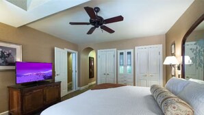 A hotel room with a large bed, a ceiling fan, a television, and a wardrobe. - Availability 11/30/19 to 12/7/19  (Beaver Creek)