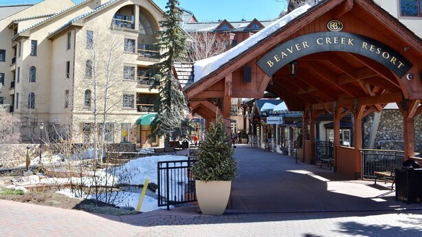 The entrance to Beaver Creek Resort with a covered walkway and a large potted plant. - Availability 11/30/19 to 12/7/19  (Beaver Creek)