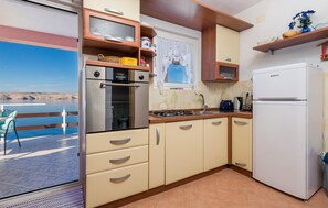 Fridge, stovetop, coffee/tea maker, cookware/dishes/utensils