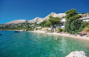 Enjoy stunning sea views from your balcony overlooking the turquoise waters and surrounding mountains.