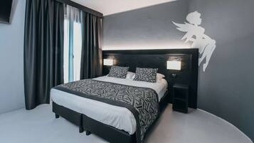 Family Room, Multiple Beds, Non Smoking | Minibar, in-room safe, individually decorated, desk