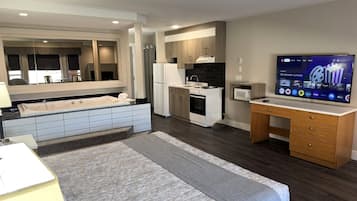 Deluxe Studio Suite, 1 King Bed, Jetted Tub | Private kitchen | Full-sized fridge, microwave, oven, stovetop