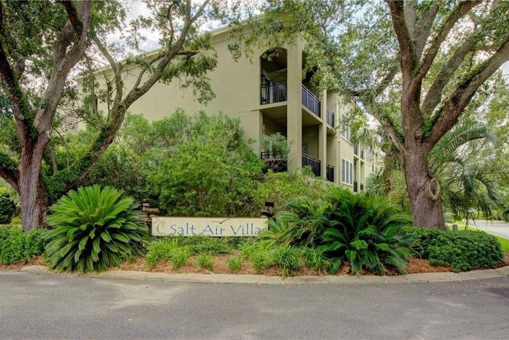 A multi-story building with a sign reading 'Salt Air Villa.'