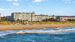 A beachfront hotel with multiple floors, balconies, and a beach view. - Tybee Beach Club 125 | Easy Walk to Beach + Pool! (Tybee Island)