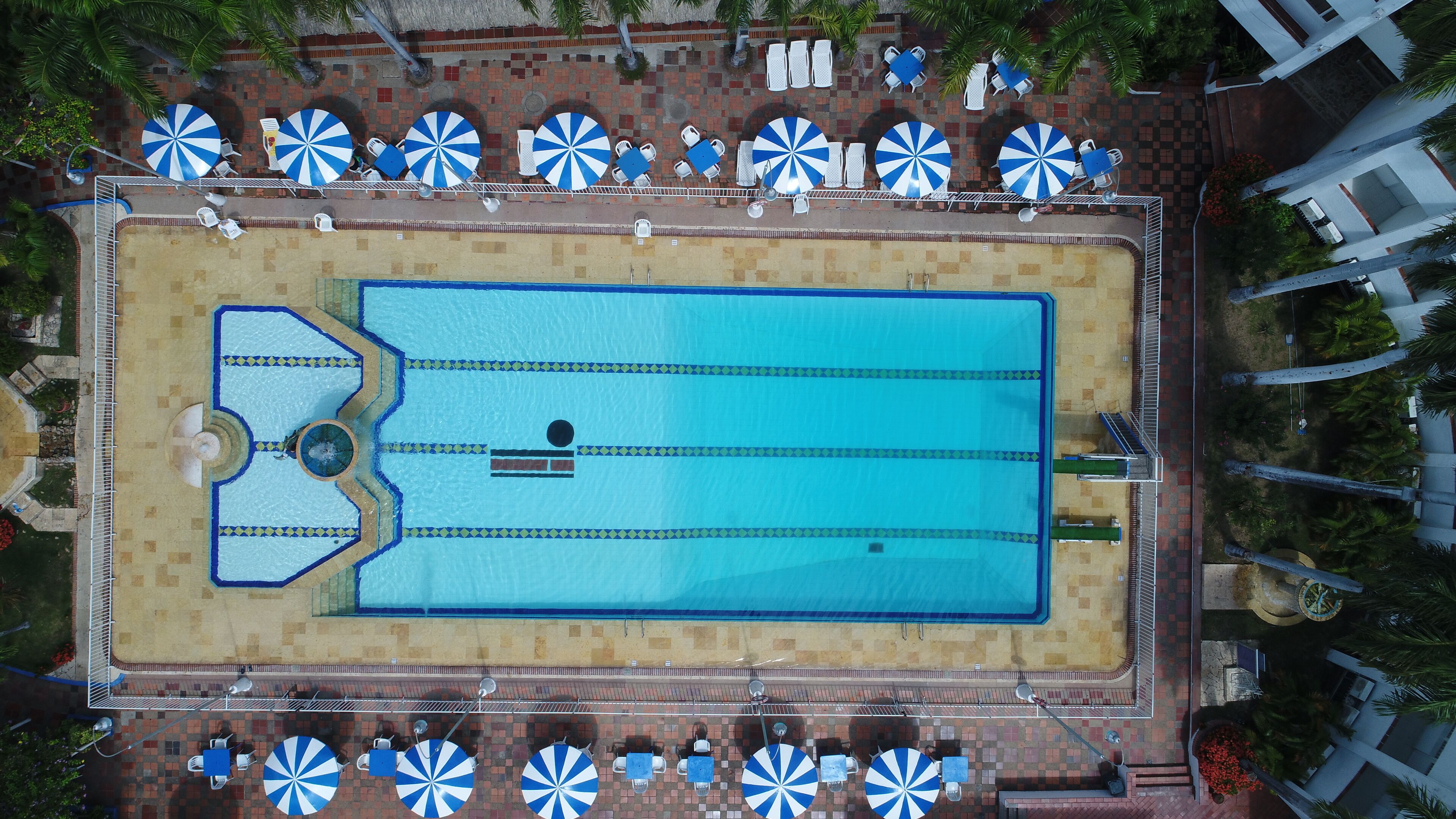 Outdoor pool, open 7:00 AM to 9:00 PM, pool umbrellas, sun loungers