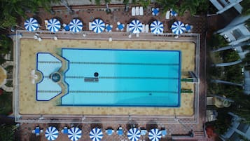 Outdoor pool, open 7:00 AM to 9:00 PM, pool umbrellas, sun loungers