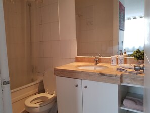 Combined shower/tub, hair dryer, towels, soap