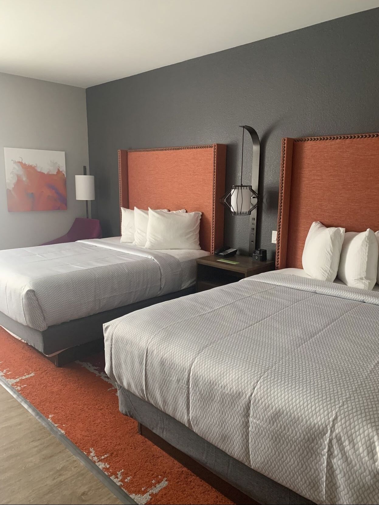Desk, laptop workspace, iron/ironing board, bed sheets