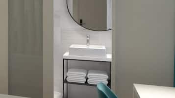 Une salle de bain moderne avec un lavabo blanc, un miroir rond et une étagère où sont pliées des serviettes.