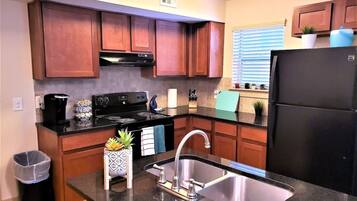 Coffee/tea maker, fridge, microwave, oven