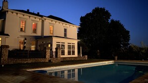 A two-story house with a swimming pool. - Wildflower Ranch Inn (Springfield)