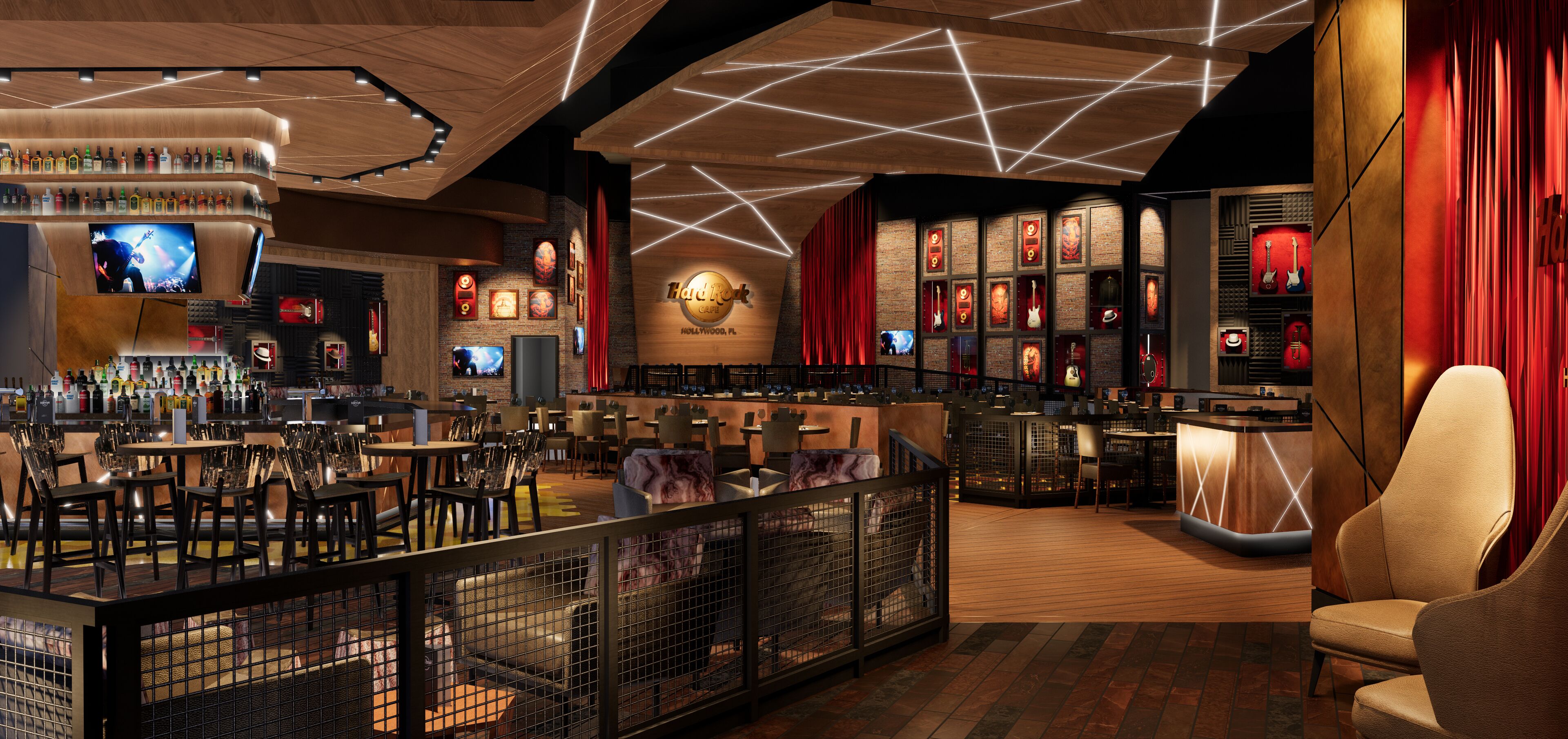 A bar area with multiple seating options, a stage with a large screen, and a display of guitars.