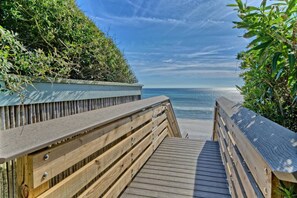 A wooden boardwalk leading to a beach with a clear view of the ocean. - A Block Away Bliss: Steps from Seaside & Sand! (Santa Rosa Beach)