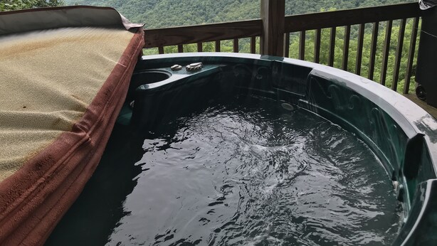 A hot tub with a view of mountains. - Breath Taking View of the Highlands of the Roan with Hot Tub and Pool Table (Roan Mountain)