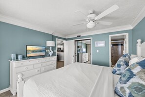 A bedroom with a bed, dresser, TV, and a ceiling fan. - ICONIC MIRAMAR BEACH EDGEWATER 2/2! SPECTACULAR GULF VIEWS!BCH SRVC INCL!!! (Miramar Beach)