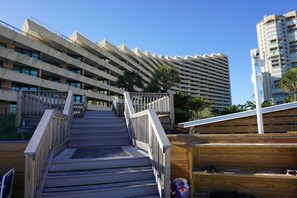 A staircase leading to a multi-story building with balconies. - ICONIC MIRAMAR BEACH EDGEWATER 2/2! SPECTACULAR GULF VIEWS!BCH SRVC INCL!!! (Miramar Beach)
