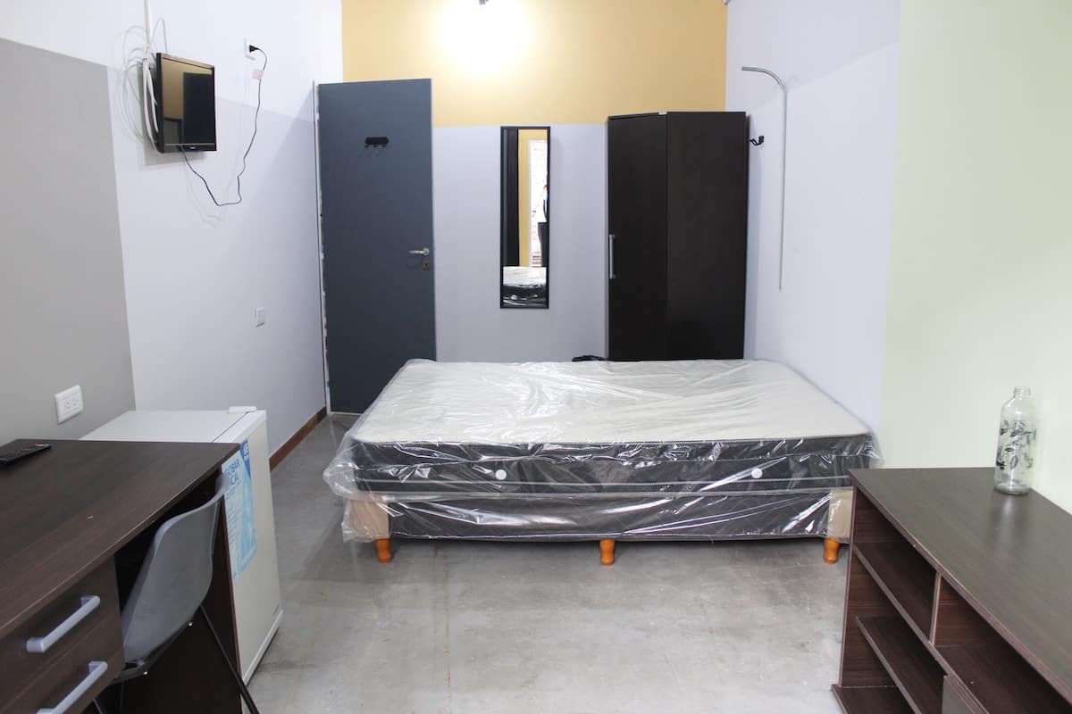 8 bedrooms, premium bedding, down duvets, desk