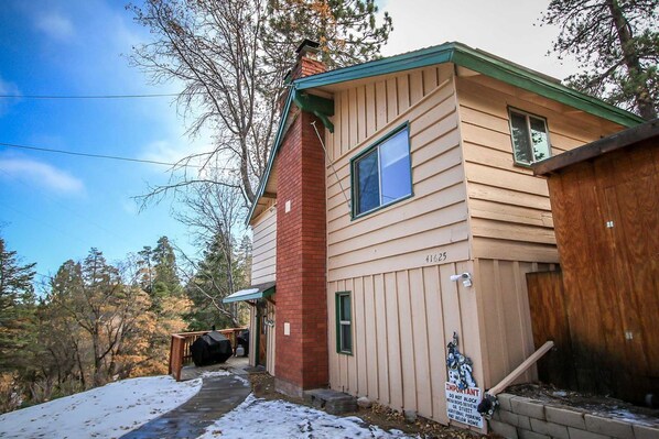 A two-story house with a green roof, a chimney, and a number 41625 on the side.
