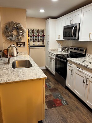 Fridge, microwave, oven, stovetop - This Ruidoso condo is located in the picturesque Sierra Blanca mountains. (Ruidoso)