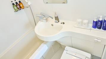 Combined shower/tub, free toiletries, hair dryer, slippers