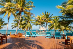 Outdoor dining - Ocean view condo at beachfront complex with AC, free WiFi, & pool (Placencia)