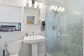 Shower, hair dryer, towels, soap