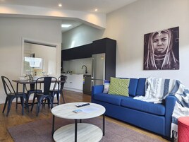Deluxe Apartment, 2 Bedrooms | Living area | 50-inch flat-screen TV with cable channels, Smart TV, Netflix