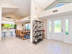 A spacious interior with a dining area, kitchen, and a large window. - SWISS 66 - Lake Denise (Clermont)