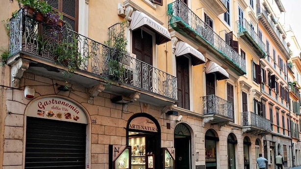 A multi-story building with a ground-floor restaurant named "Gastronomia della Vite." - The Best in Rome Vite (Rome)