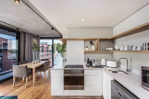 Family Apartment | Private kitchen | Full-size fridge, microwave, oven, stovetop - ITC Docklands (Cape Town)