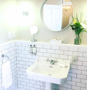 Shower, slippers, towels, toilet paper