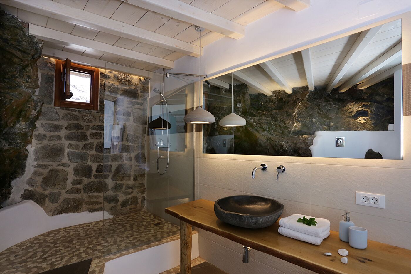 deluxe suite | bathroom | hair dryer, towels, toilet paper