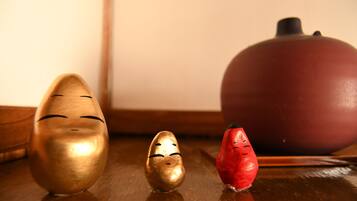 Three wooden figures on a wooden surface.