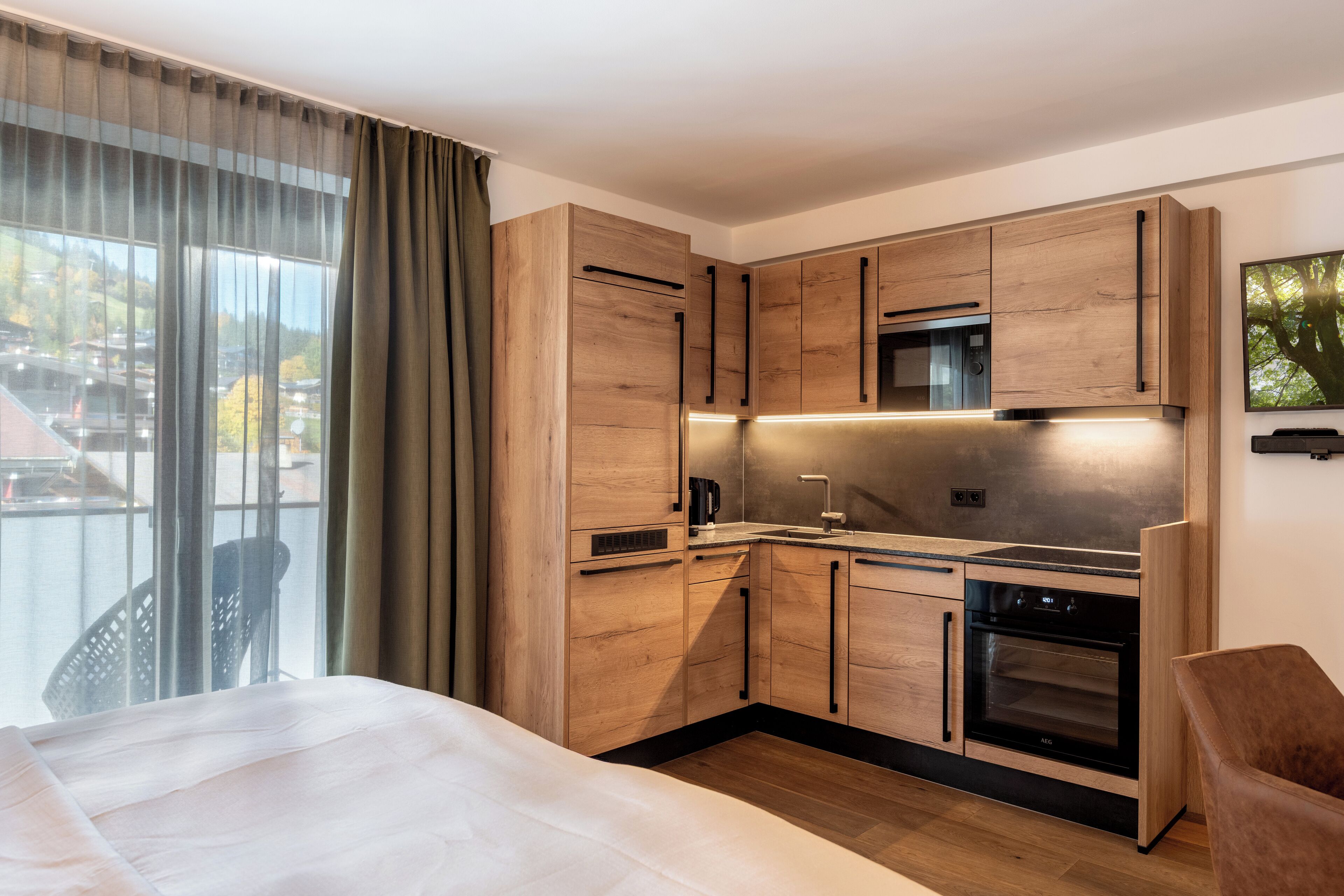 Standard Studio, Balcony, Mountain View | Living area | 42-inch LCD TV with satellite channels, heated floors