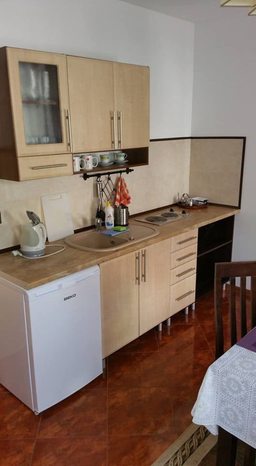 Apartment | Private kitchen | Fridge, stovetop, electric kettle, high chair