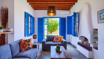 Executive Villa, 3 Bedrooms, Private Pool, Beachfront | Living room | LED TV, fireplace